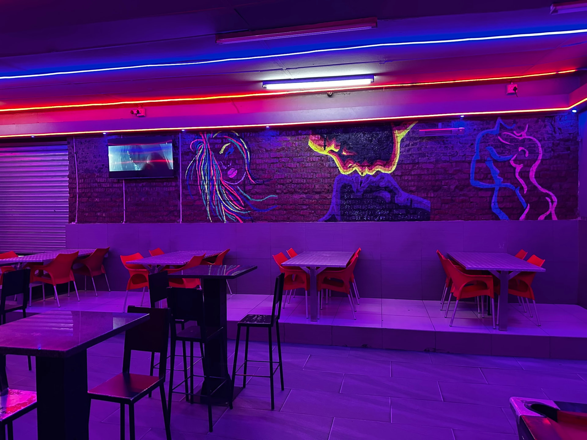 Graffiti mural wall and seating at Cheeky Tiger Germiston
