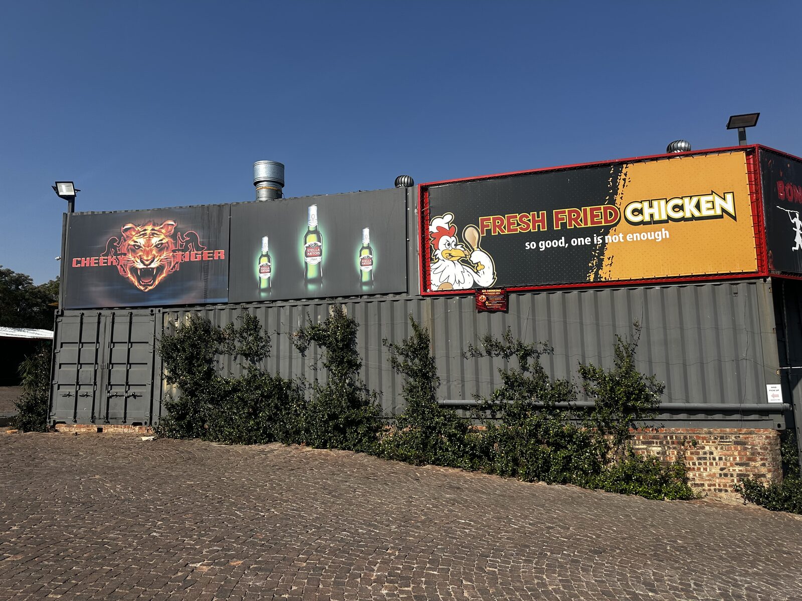Cheeky Tiger Midrand exterior signage on the container facade