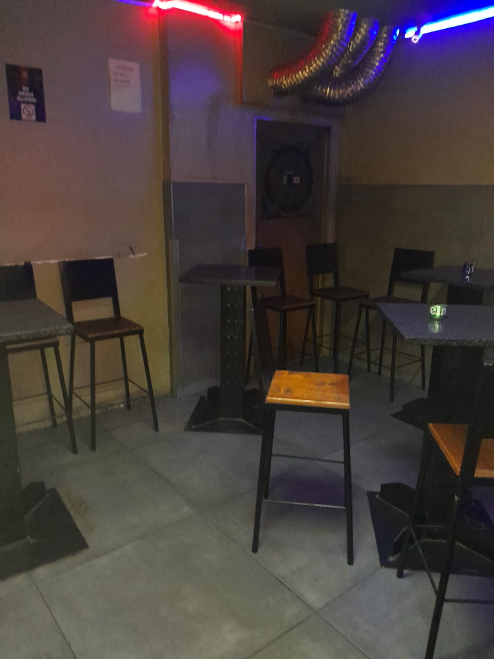 Quiet seating corner with high tables at Cheeky Tiger Randburg